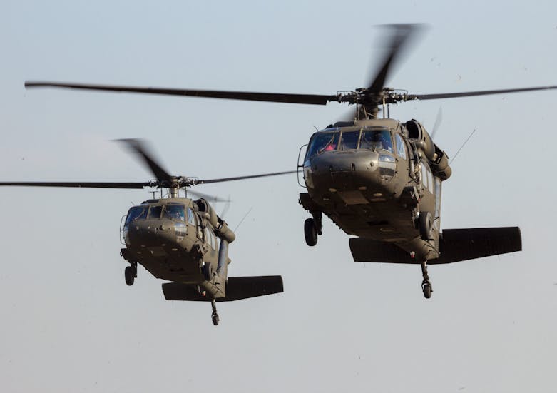 GRAVE, NETHERLANDS - SEP 17, 2014: Two American Army Blackhawk helicopter landing.
