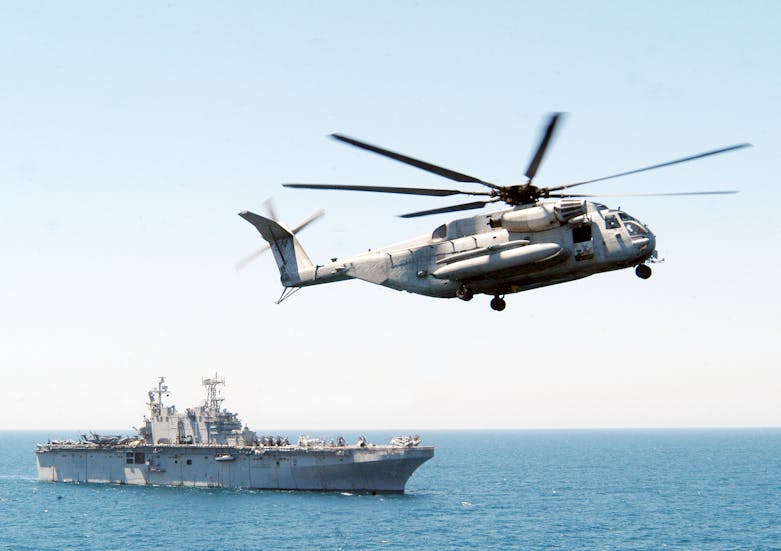 030430-N-2819P-043
The Arabian Gulf (Apr. 30, 2003) -- A CH-53E ÒSuper StallionÓ helicopter from Marine Heavy Helicopter Squadron (HMM-464) transfers a gear box from USS Tarawa (LHA 1) to USS Kearsarge (LHD 3). Kearsarge is deployed to the Arabian Gulf in support of Operation Iraqi Freedom, the multi-national coalition effort to liberate the Iraqi people, eliminate Iraq's weapons of mass destruction, and end the regime of Saddam Hussein. U.S. Navy photo by PhotographerÕs Mate 3rd Class Jose E. Ponce. (RELEASED)